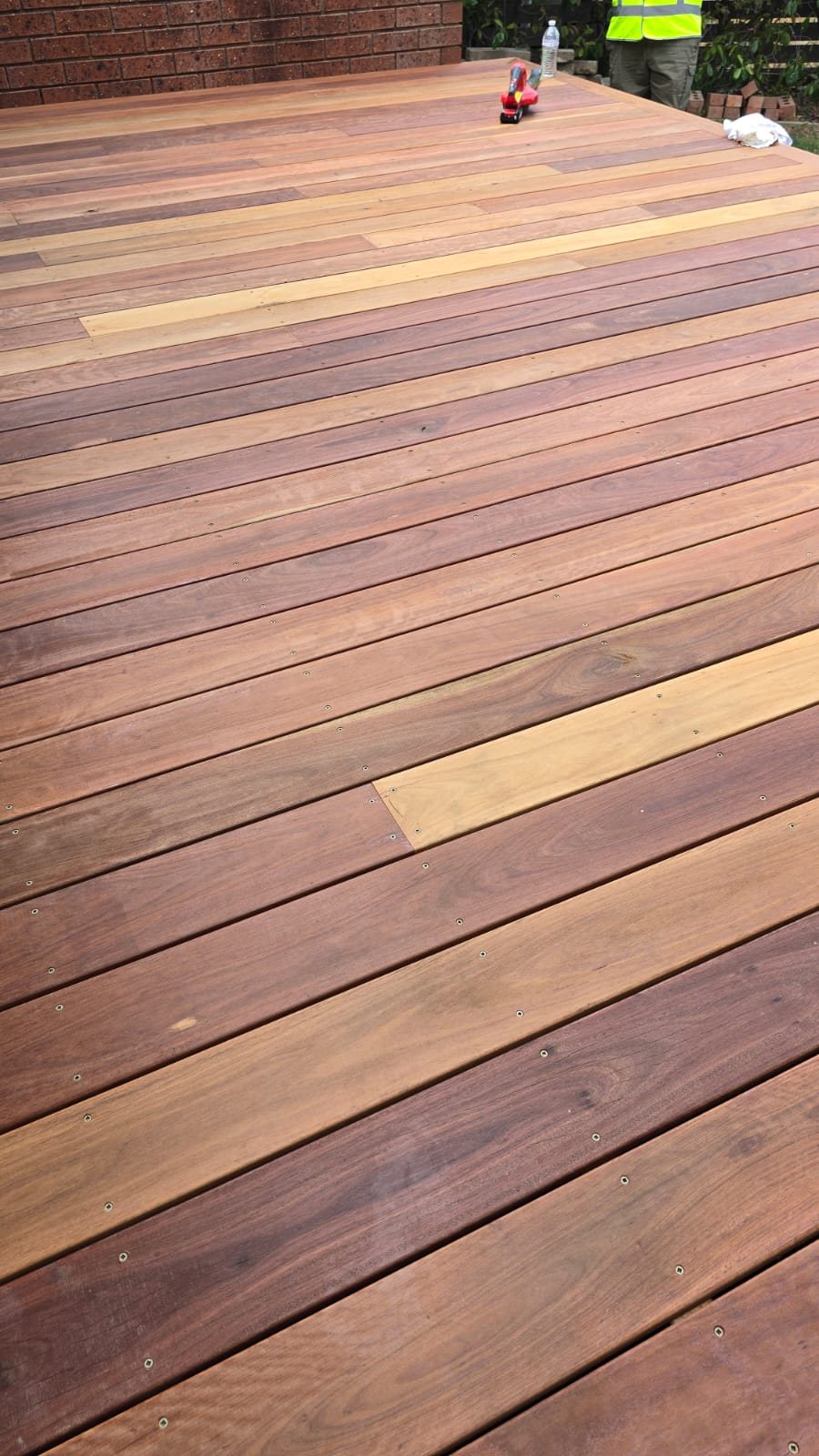 Close-up detail of a freshly stained hardwood deck